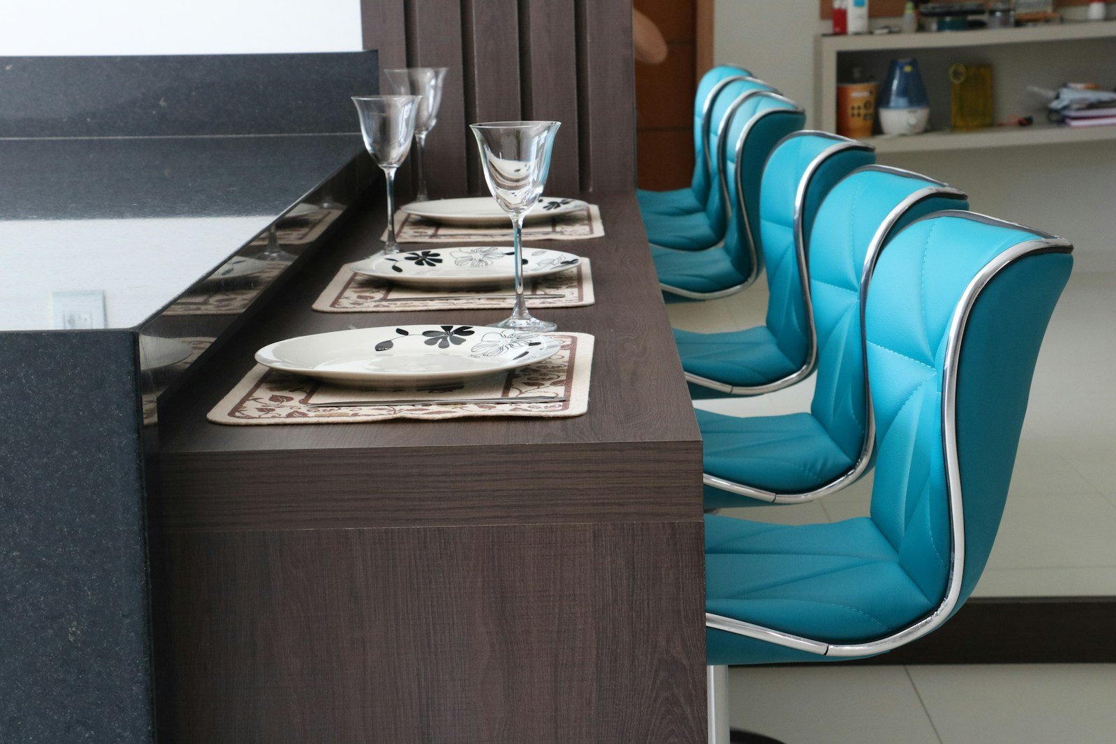 clear footed wine glass on brown wooden table